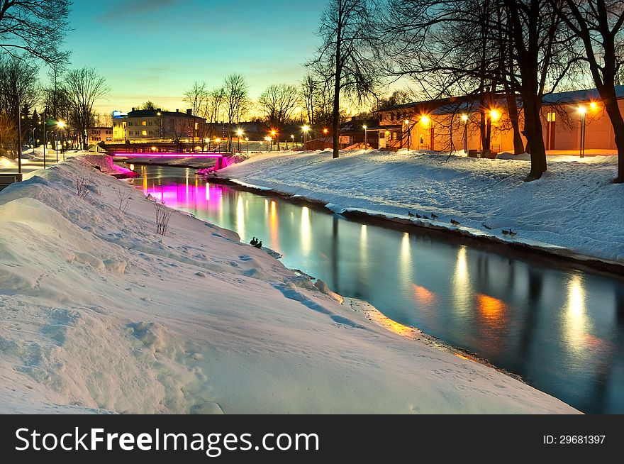 City embankment in winter at sunset with beautiful lighting