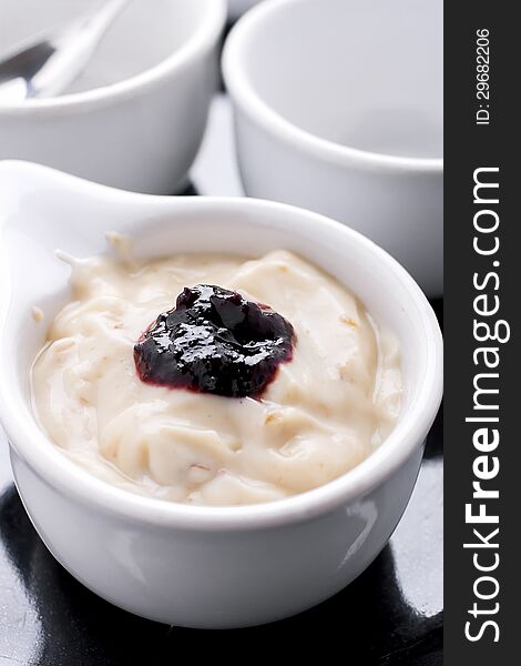 Prune yogurt with mulberry jam on top