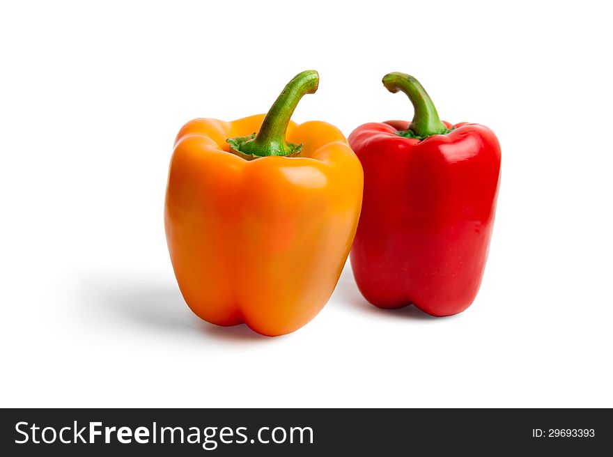 Fresh colored peppers on white background
