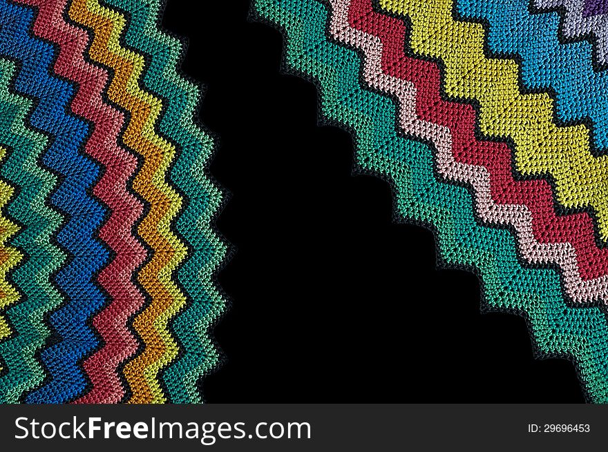 Detail of colorful knitted blankets pillows. Detail of colorful knitted blankets pillows