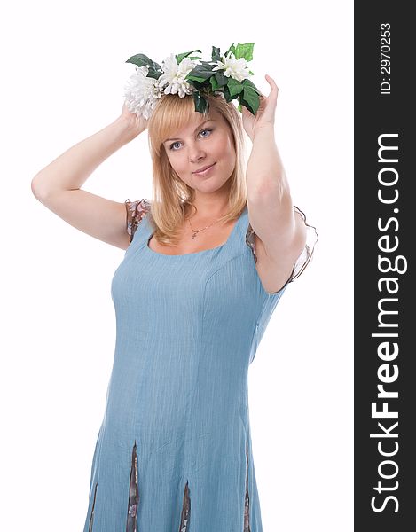The attractive pregnant woman with a wreath of flowers. The attractive pregnant woman with a wreath of flowers