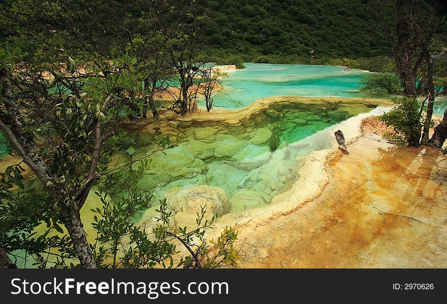 Limestone formations and hot springs in the Huanglong Valley, China. Limestone formations and hot springs in the Huanglong Valley, China.