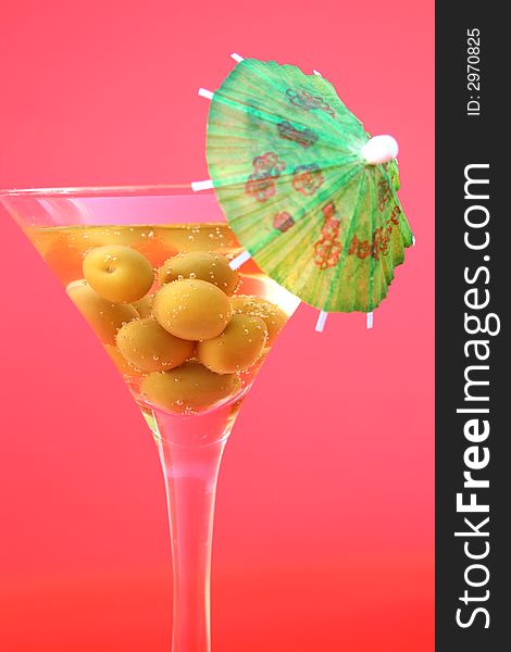 Olive Cocktail drink on a red background