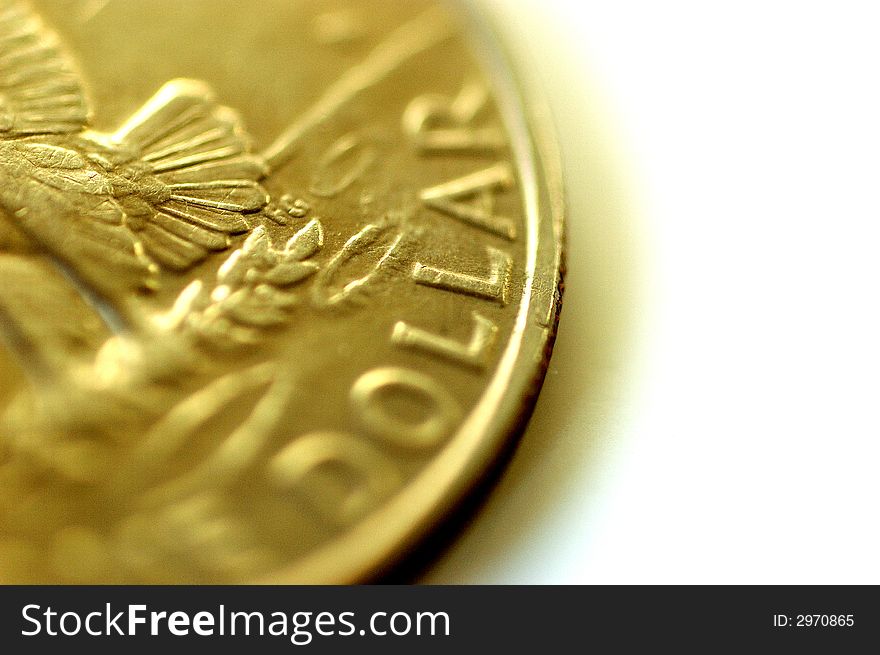 Close-up of gold one dollar coin
