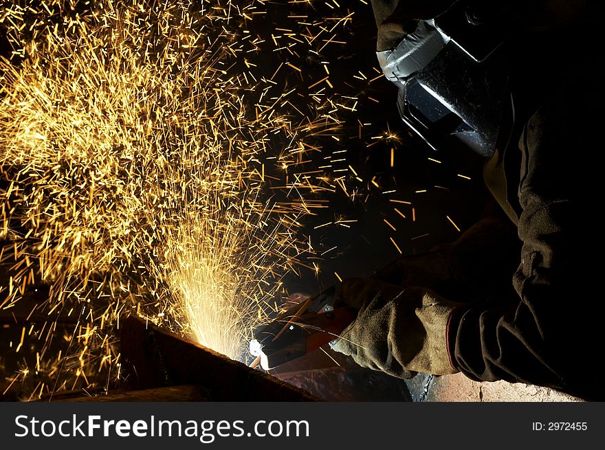 One welder working at night. One welder working at night