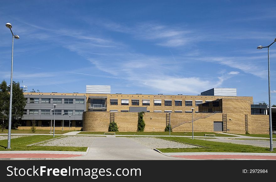 Modern university building on the blue sky background. Modern university building on the blue sky background