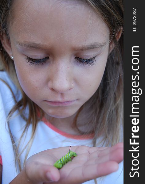 Girl holding Tobacco horn worm