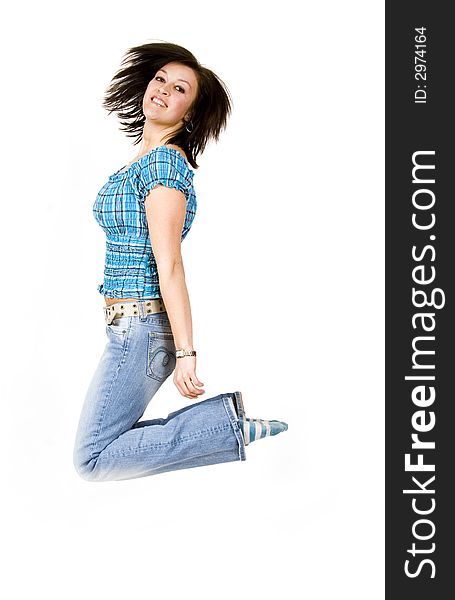 Beautiful young woman jumping - white background