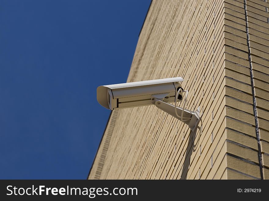 Security camera on the brick wall