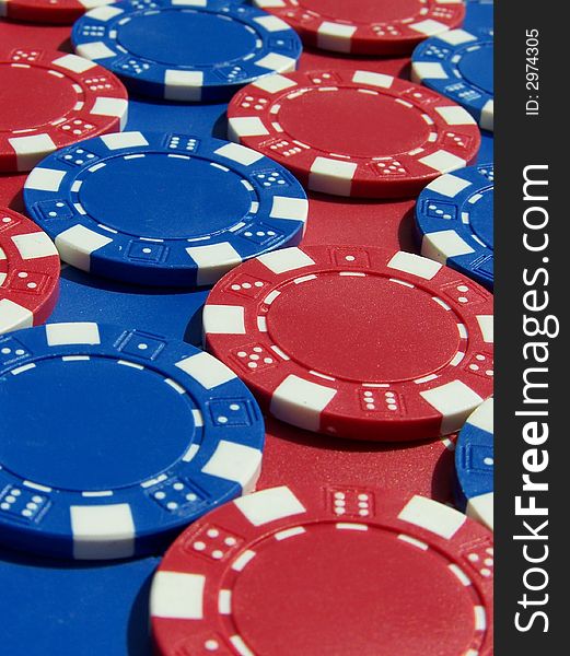 Red and blue poker chips in rows.