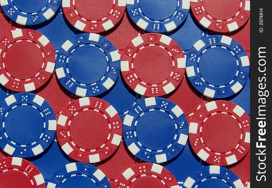 Red and blue poker chips in rows.