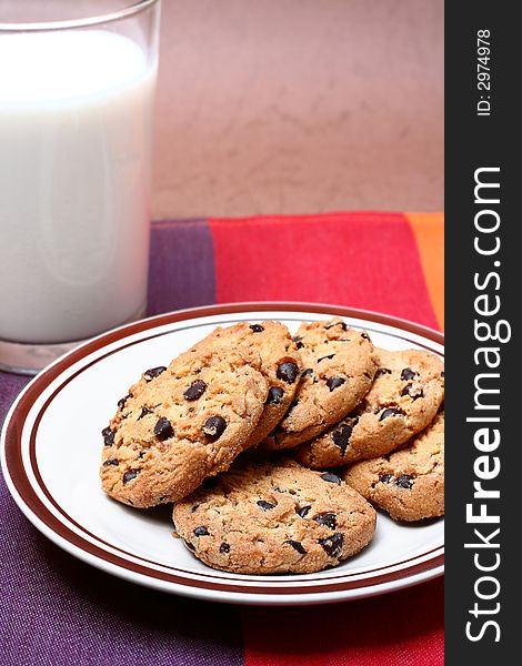Chocolate chip cookies with a glass of milk
