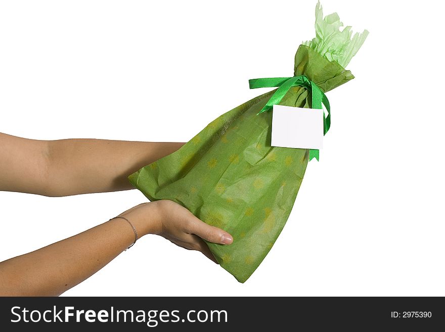 Woman holding a wine bottle with green wrap with a green ribbon over white back ground. Woman holding a wine bottle with green wrap with a green ribbon over white back ground