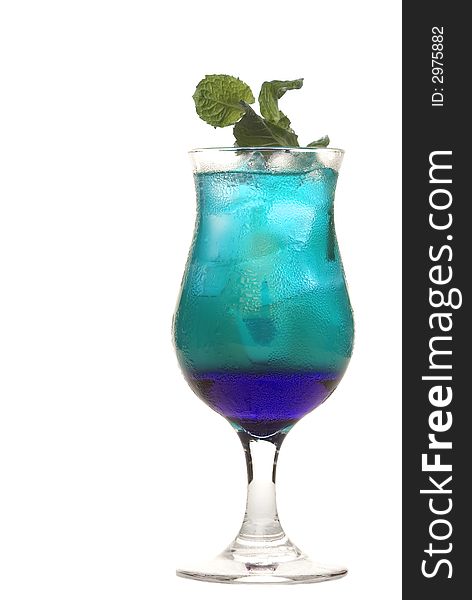Colorful alcoholic cocktail in a glass against white background. Colorful alcoholic cocktail in a glass against white background