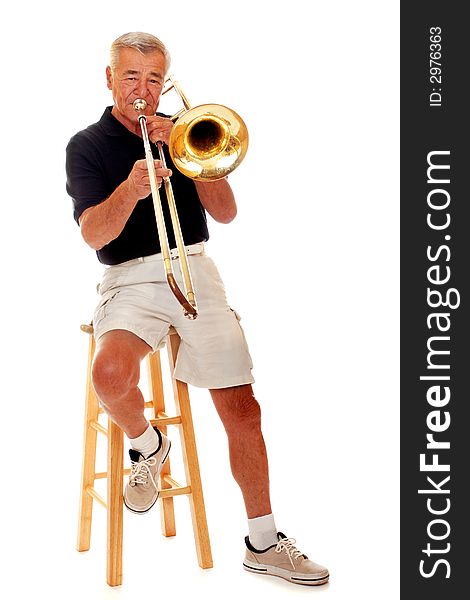 Front view of a senior man playing his trombone. Isolated on white. Front view of a senior man playing his trombone. Isolated on white.