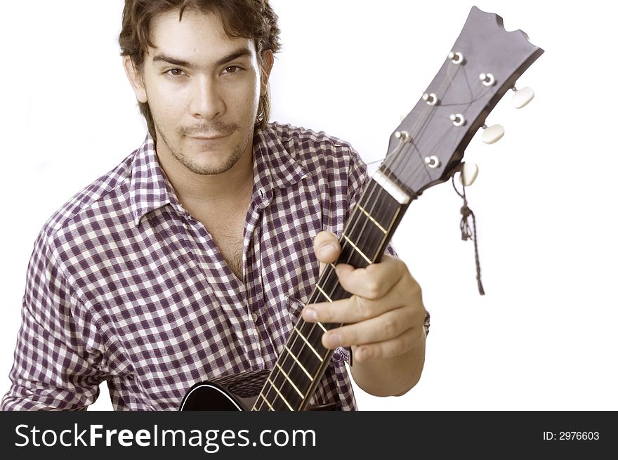 A young handsome boy playing acoustic guitar - isolated. A young handsome boy playing acoustic guitar - isolated