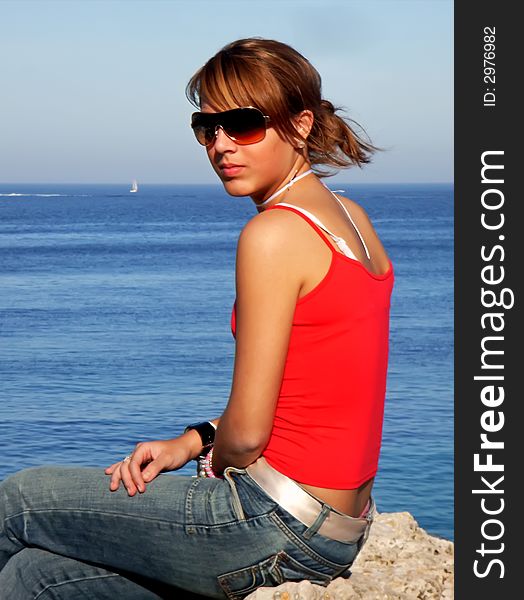 Young teenager girl near the mediterranean sea