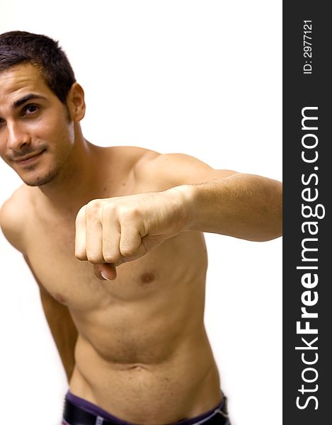 Portrait of young shirtless male punching - isolated over white background. Portrait of young shirtless male punching - isolated over white background