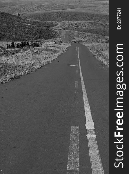 A black and white version of a deserted road in South Africa. A black and white version of a deserted road in South Africa