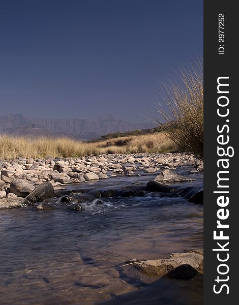 Beautiful stream in the Drakensberg with the berg in the background. Beautiful stream in the Drakensberg with the berg in the background