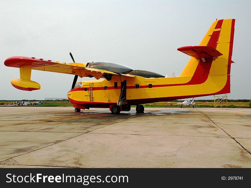 Government aircraft, water bomber, used to handle forest fires.  The aircraft can land on water,take on more water from below to spray on the fires.