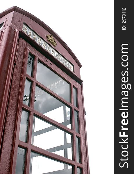 A red antique british phone booth. A red antique british phone booth.