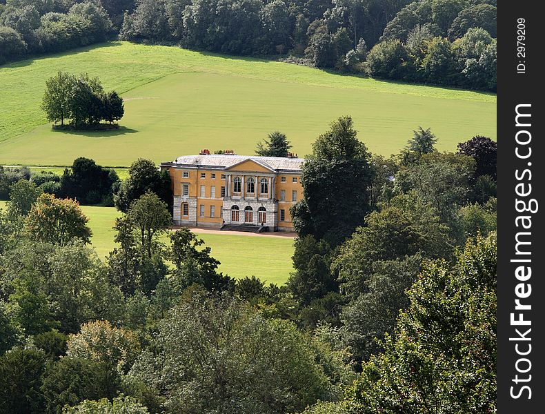 Stately Home set amongst Trees and Parkland in Rural England