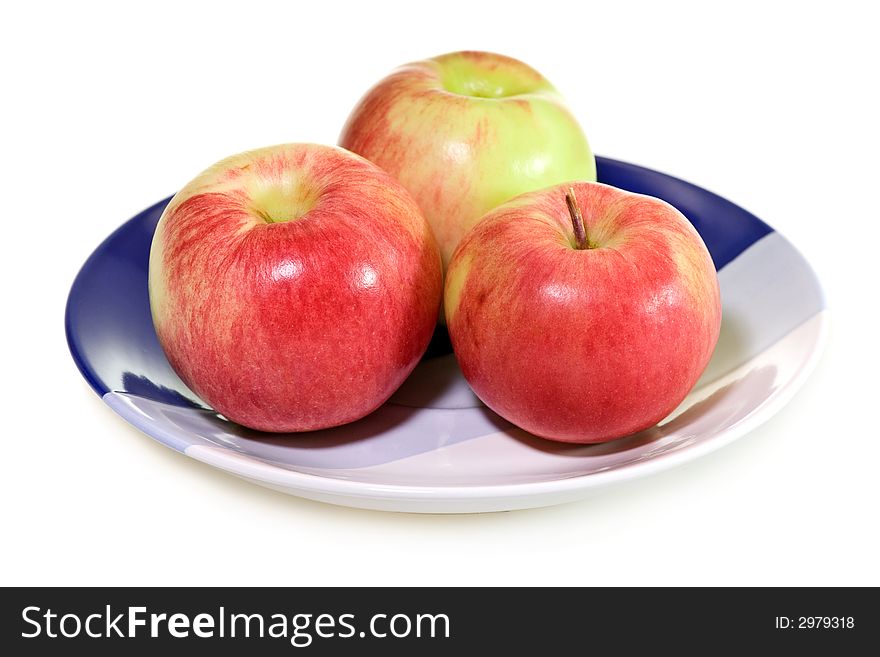 Three apples on the plate isolated on white background.