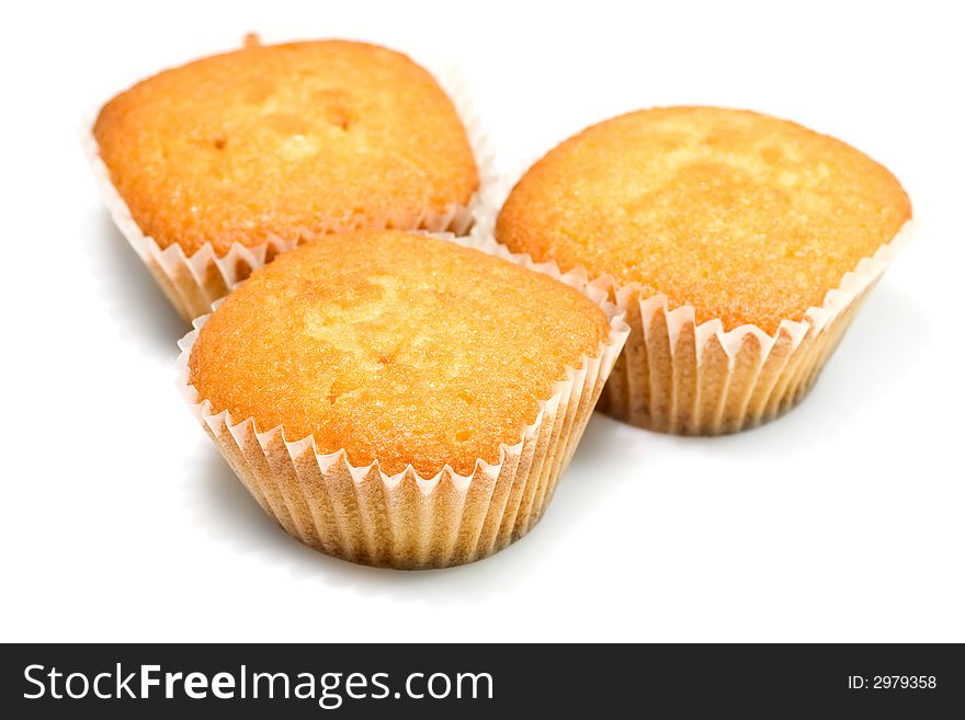 Three tasty muffins isolated on white background.