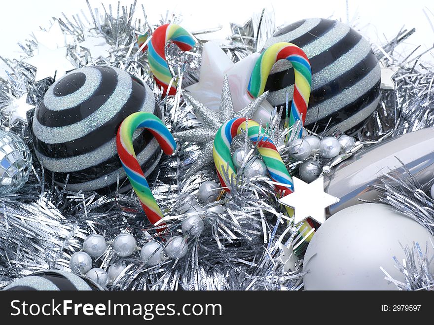 Candy canes amongst christmas ornaments. Candy canes amongst christmas ornaments.