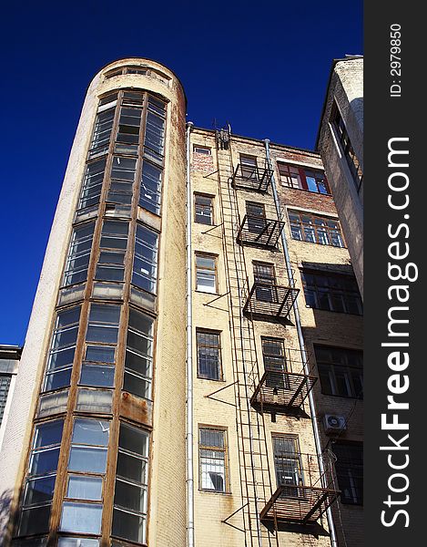 Old yellow brick building with blue sky. Old yellow brick building with blue sky