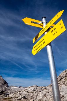 Yellow Sign-board Against Mountain Scenery Royalty Free Stock Image