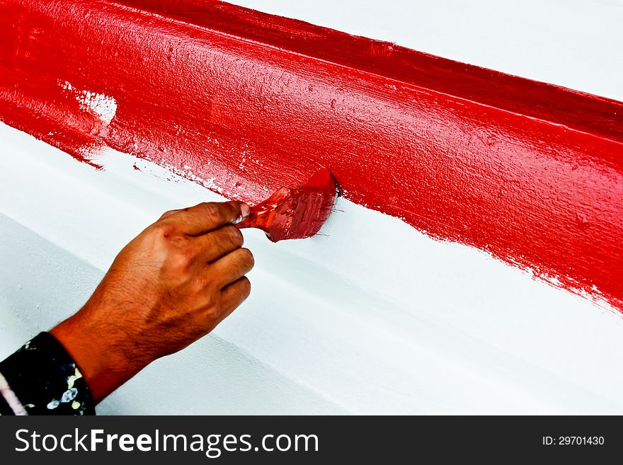 The paint brush red color by hand