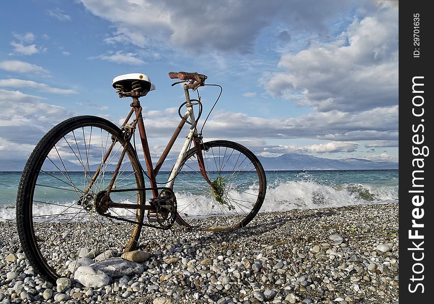 A rusty classic bike at seaside of a beach in Greece. A rusty classic bike at seaside of a beach in Greece