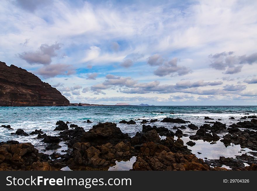 Beach of Lansarote - volcanic island , Canary, Spain. Beach of Lansarote - volcanic island , Canary, Spain