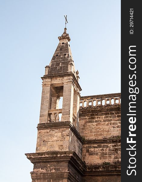 Old stone church tower in Seville Spain