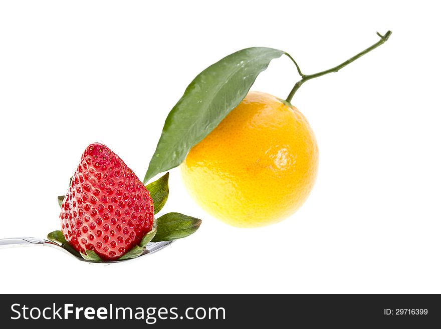 Strawberry and an orange isolated on white. Strawberry and an orange isolated on white.