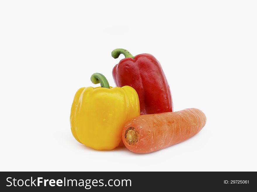 Red and yellow sweet paper with carrot on white background. Red and yellow sweet paper with carrot on white background