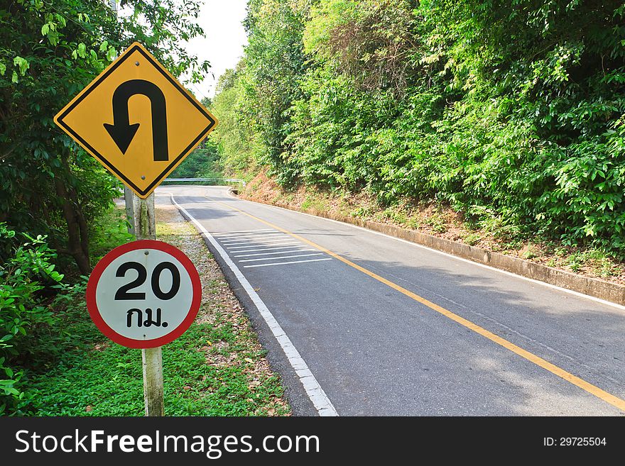 U-turn symbol Road in rustic city in Thailand