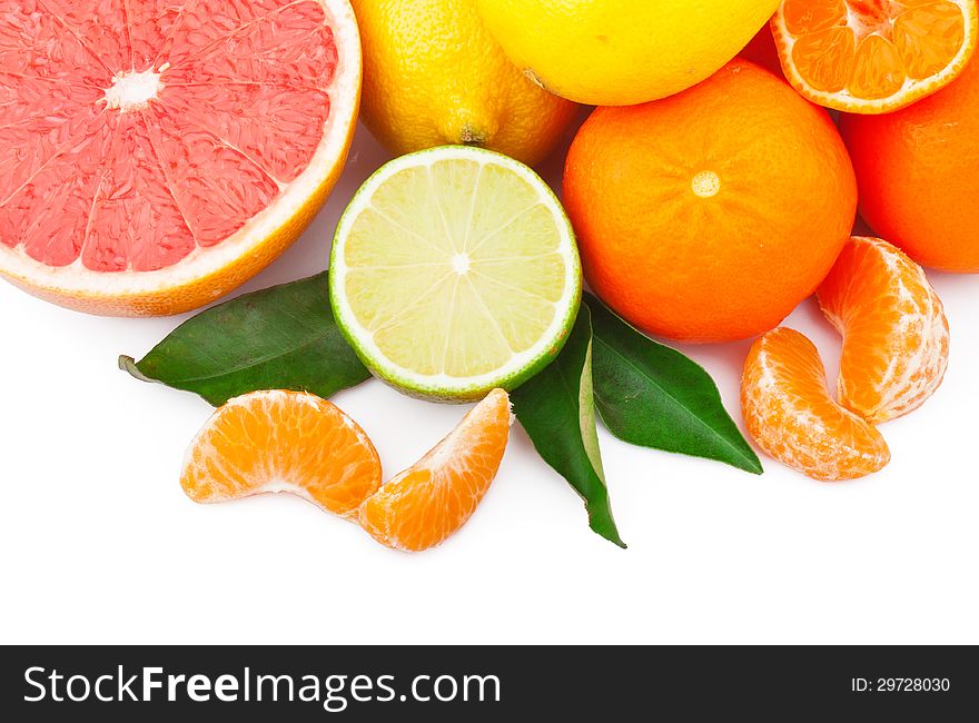 Fresh citrus fruits whole and half with green leaves, food ingredient photo