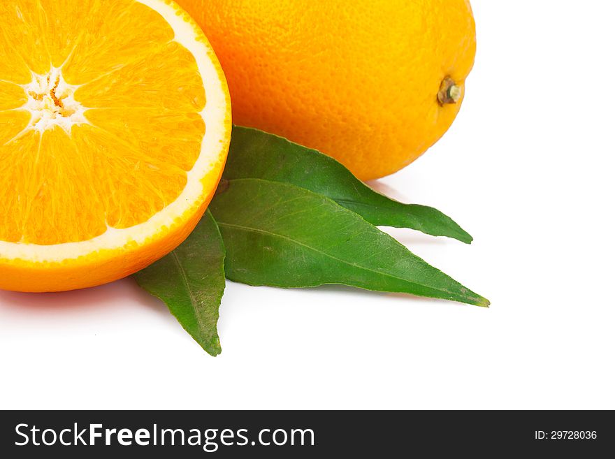 Fresh oranges fruit with green leaves,  on white background. Fresh oranges fruit with green leaves,  on white background