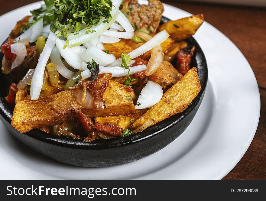 Beef Stew With Potatoes, Carrots And Herbs On Black Background With Copy