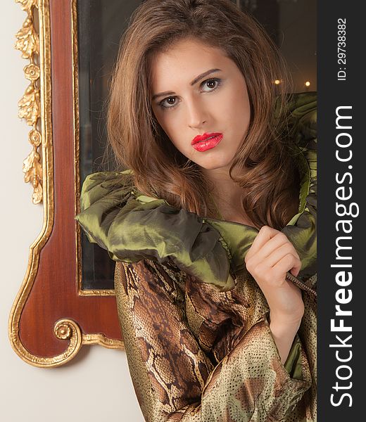 A portrait of a pretty young woman in front of a mirror. A portrait of a pretty young woman in front of a mirror