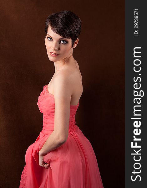 An image of a pretty model in a pink gown. An image of a pretty model in a pink gown