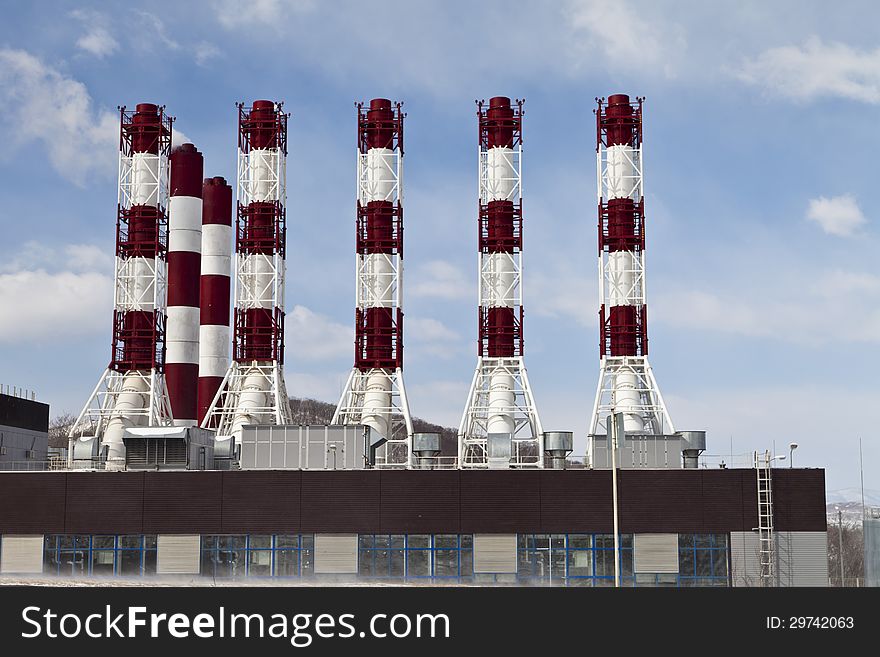 Power plant pipes against the blue sky