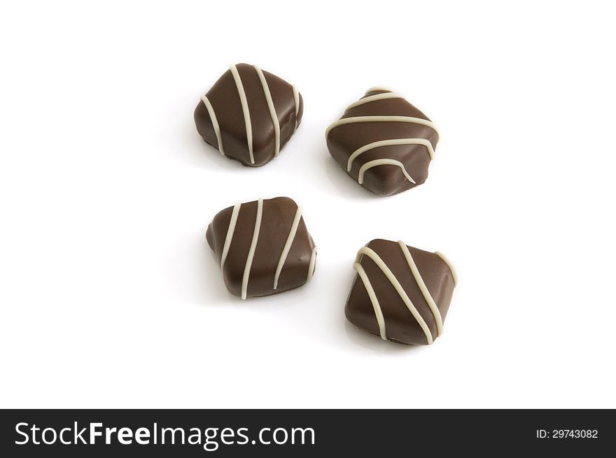 Four chocolates isolated on a white background. Four chocolates isolated on a white background
