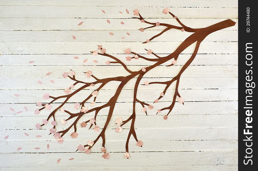 Paper cutout of tree branch on the wooden background. Paper cutout of tree branch on the wooden background