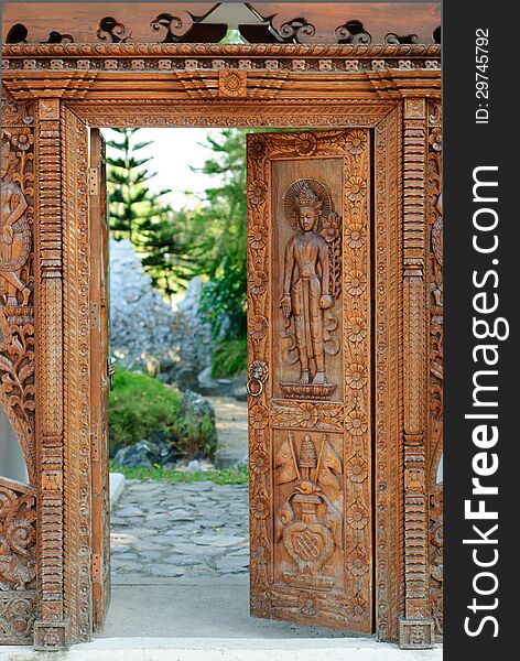 Asian carved doors. Arch on display in the park.