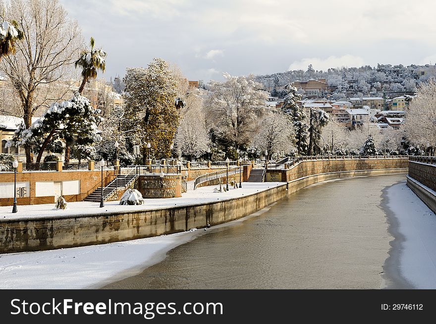 Snow storm with slush on sidewalks. Granada, Andalusia, Spain