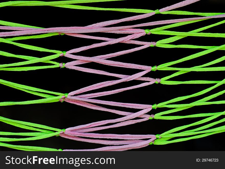 Colorful hammock on a black background.